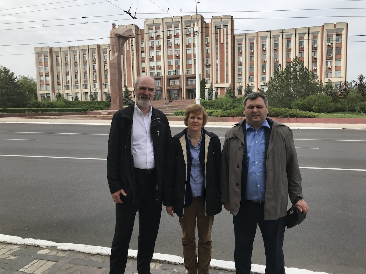 The Schirrmachers and their host in front of the Parliament in Tiraspol © private